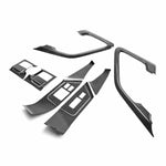 Seibon CFI0910NSGTR-C Carbon fiber interior door trim set (12 pcs) for 2009-2016 Nissan GTR. Pieces include: Door handle cover (2), window switch panel cover (6), door lever surround (4)